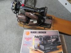 A SINGER SEWING MACHINE WITH A DOUBLE DECKER SANDER