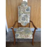 AN EARLY 20TH CENTURY UPHOLSTERED ARTS & CRAFTS STYLE ARMCHAIR