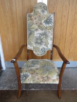 AN EARLY 20TH CENTURY UPHOLSTERED ARTS & CRAFTS STYLE ARMCHAIR