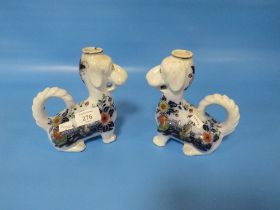 TWO UNUSUAL 19TH CENTURY CHAMBER STICKS, IN THE FORM OF DOGS WITH CHINOISERIE DECORATION H 15.5 CM