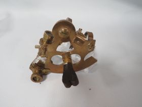 A SMALL BRASS SEXTANT