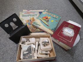A VINTAGE FOLDING VIEWER AND CAVANDERS PEEPS INTO MANY LANDS , RUPERT ANNUALS, POSTCARDS ETC