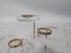 A 9CT YELLOW GOLD BAND SET WITH STONES - SOME MISSING approx weight 2.7g TOGETHER WITH 2 GOLD