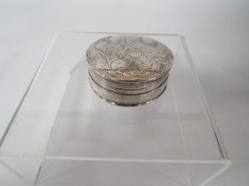 TWO SMALL SILVER PILL BOXES