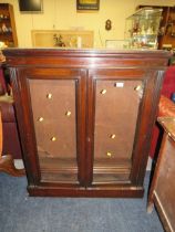 AN ANTIQUE GLAZED TWO DOOR BOOKCASE