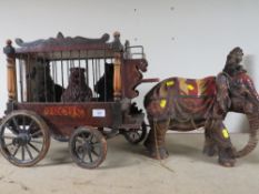 A LARGE VINTAGE WOODEN CIRCUS TRAILER WITH AN ELEPHANT