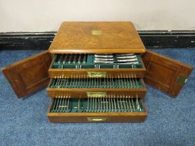 AN EXTENSIVE WALNUT CASED CANTEEN OF PLATED CUTLERY, twelve place setting, approximately 107 pieces