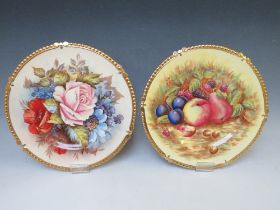 A NEAR PAIR OF AYNSLEY CABINET PLATES SIGNED J.A. BAILEY AND N. BRUNT, the Bailey plate with flowers