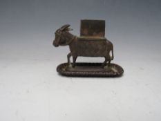 A 19TH CENTURY METAL BRYANT AND MAY VESTA, in the shape of a donkey, H 11 cm, L 14 cm