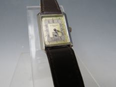 A VINTAGE ART DECO STYLE LE CHEMMANT RECTANGULAR WRISTWATCH, in fitted leather covered case, 3 x 2.5