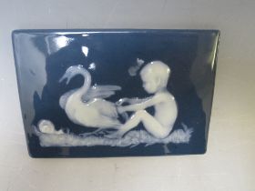 A LIMOGES PATE SUR PATE PLAQUE SIGNED LEROUX, depicting a child, swan and snail, 10.5 x 16 cm