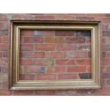 A GILT RECTANGULAR PICTURE FRAME, with acanthus moulded detail, rebate 83 x 57 cm