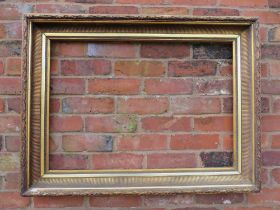 A GILT RECTANGULAR PICTURE FRAME, with acanthus moulded detail, rebate 83 x 57 cm