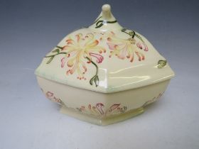 A COBRIDGE TRIAL TUREEN AND LID, decorated with a floral pattern, impressed factory mark, signed