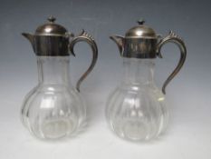 A PAIR OF HALLMARKED SILVER TOPPED CLARET JUGS - SHEFFIELD 1896, H 22 cm (2)