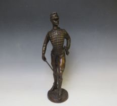 A LATE 19TH / EARLY 20TH CENTURY BRONZE FIGURE STUDY OF A FRENCH ARMY OFFICER WITH SWORD, raised