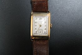 A 1930'S STYLE ART DECO 9CT GOLD TANK TYPE 'CRUSADER' WRIST WATCH, on replacement leather strap, W