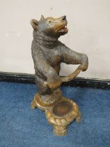 A BLACK FOREST STYLE CARVED STANDING BEAR STICK STAND, with arms outstretched, H 89 cm