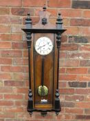 A SLIM CASED 8 DAY VIENNA REGULATOR WALL CLOCK, the mahogany case having ebonised columns, the