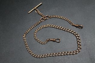 A GRADUATING 9CT ROSE GOLD ALBERT CHAIN WITH T-BAR, stamped on every link although many rubbed,