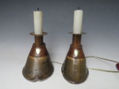A PAIR OF HORSE HOOF CANDLE STICKS, converted to table lamps, each with an attached shield inscribed