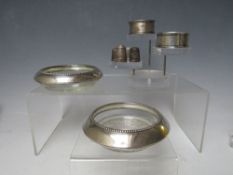 A PAIR OF SILVER MOUNTED DISHES, together with two hallmarked silver napkin rings and three