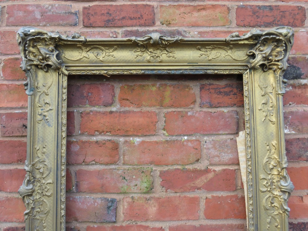 A GILT RECTANGULAR PICTURE FRAME, with raised moulded foliate detail, rebate 65 x 52 cm - Image 2 of 4