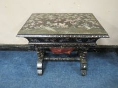 A MID VICTORIAN EBONISED AND MOTHER OF PEARL WORK TABLE, the top opening to reveal numerous