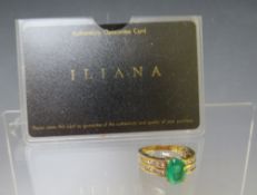 AN 18CT GOLD 'ILIANA' EMERALD RING, with diamond set shoulders, the certificate states it is a Colum