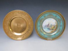 A MINTON 'WINDSOR CASTLE' CABINET PLATE SIGNED A. HOLLAND, together with a full gilt companion,