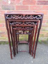 AN EASTERN QUARTETTO OF FOUR TABLES, each modelled in a traditional style with shaped supports,