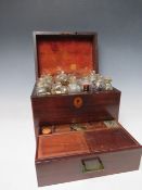 A GEORGE III MAHOGANY APOTHECARY BOX, with drawer at base, containing various bottles and equipment,