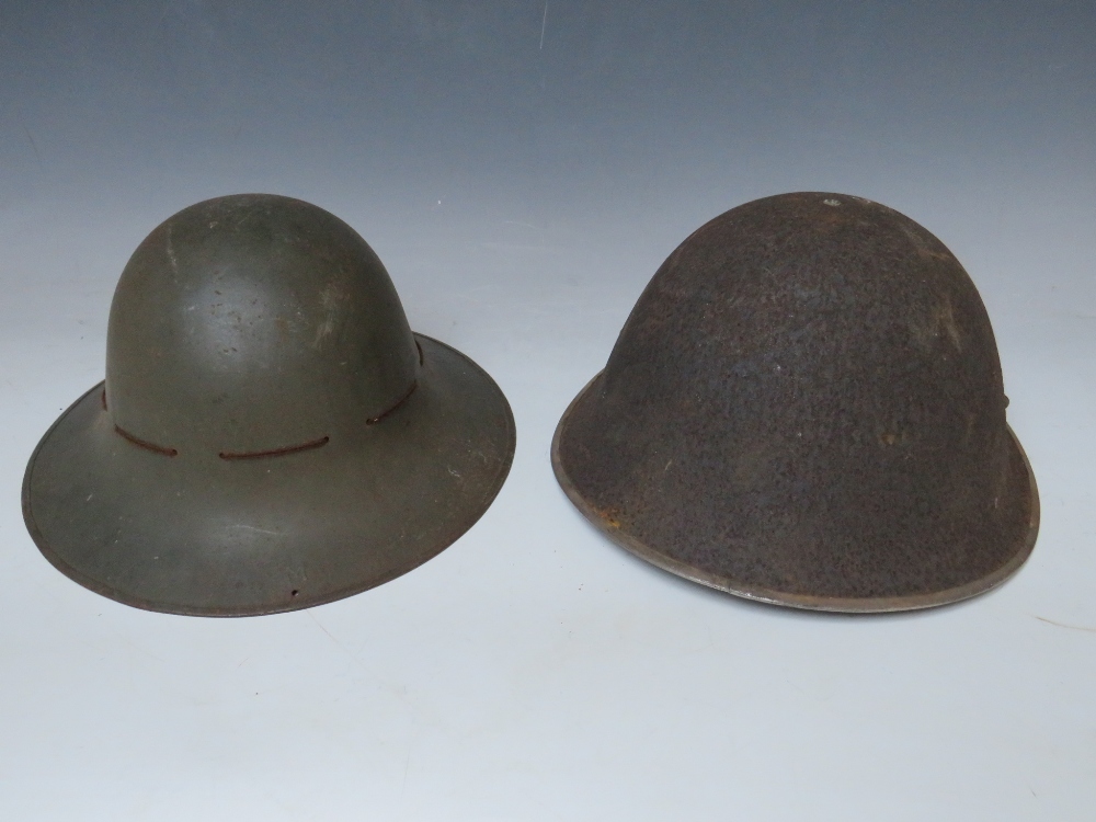 A BRITISH TIN HELMET DATED 1941, with stencilled S.F.P. to the front together with an Eastern