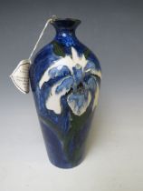 A COBRIDGE TRIAL BALUSTER VASE, decorated with blue floral pattern, impressed factory marks, H 24
