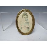 A 19TH CENTURY OVAL PORTRAIT MINIATURE OF A YOUNG WOMAN, unsigned, watercolour on paper, framed