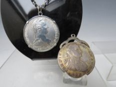 A MARIA THERESA THALER ON MARKED SILVER CHAIN, together with Ferdinand VII Thaler 1809 (2)