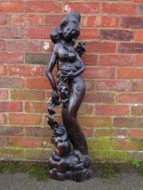 AN UNUSUAL EASTERN HARDWOOD CARVED FIGURE, depicting a semi-clad girl with a baby and a further