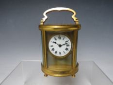 A 19TH CENTURY FRENCH BRASS OVAL CARRIAGE CLOCK, H 11 cm