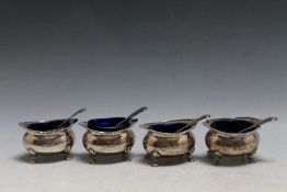 A SET OF FOUR HALLMARKED SILVER SALT DISHES BY COOPER BROTHERS & SONS LTD - SHEFFIELD 1906, raised