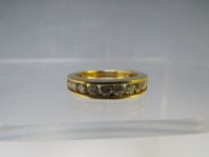 AN 18CT GOLD 'ILIANA' HALF ETERNITY DIAMOND RING