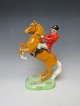 A BESWICK RARE HUNTSMAN ON REARING PALOMINO - No. 868, H 24 cm