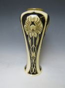 A COBRIDGE TALL SLENDER BALUSTER VASE, decorated with panels of Art Nouveau flowers, on and ivory