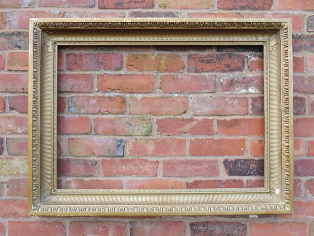 A GILT RECTANGULAR PICTURE FRAME, with egg and dart moulded detail, rebate 82 x 57 cm