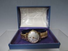 A TISSOT 9CT GOLD CASED WRISTWATCH, on expanding yellow metal strap, together with original box