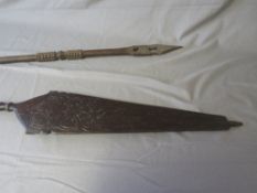 A LARGE INDONESIAN DAYAK BORNEO CARVED CANOE PADDLE, and a West African Benin tribal paddle (2)