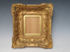 A 19TH CENTURY SMALL DECORATIVE GOLD FRAME, with gold slip and glazed, frame W 7 cm, slip rebate
