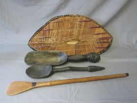 AN EAST AFRICAN UGANDA GANDA WICKER SHIELD WITH HANDLE, a large Zulu porridge spoon, a West