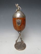 A VICTORIAN OAK AND SILVER PLATED CUP AND COVER, on a plated stand, H 28 cm