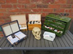 A SELECTION OF DENTISTRY EQUIPMENT AND TEACHING AIDS, to include a human skull with sliced cranium