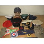 A COLLECTION OF VARIOUS MILITARY CAPS AND BERETS ETC., to include Naval and German types, along with